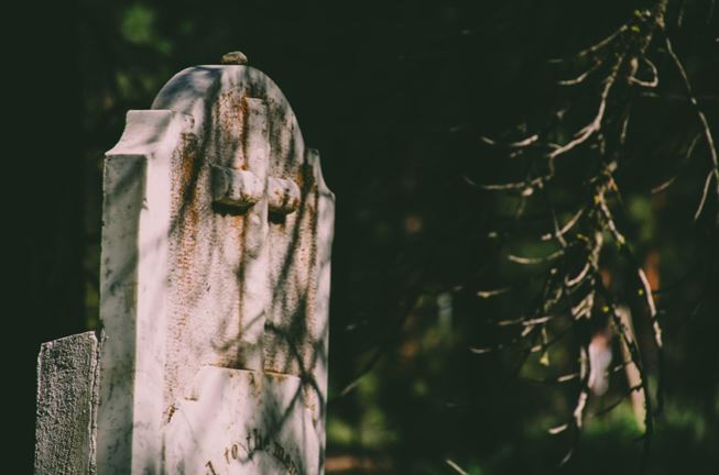 Old headstone with a cross