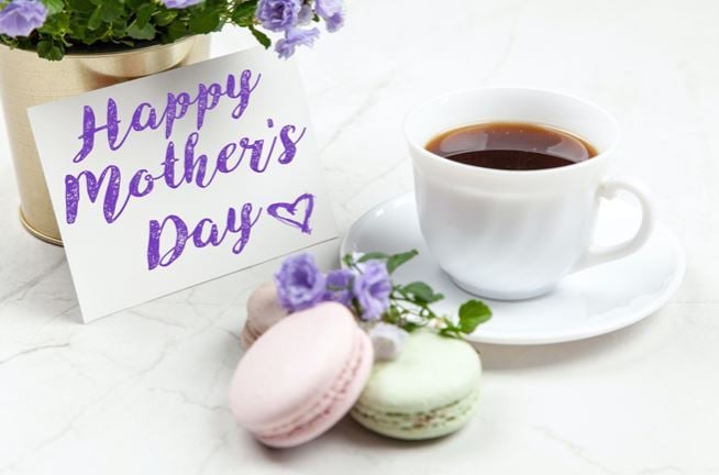Two cookies and a cup of coffee as desert for a Mother's Day brunch. The card read Happy Mother's Day