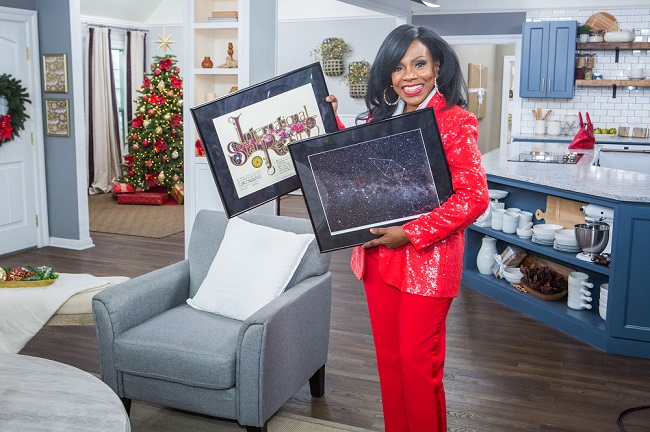 Sheryl Lee Ralph holding her name a star certificate and Sky Image from starregistry.com