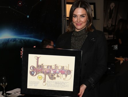 Taylor Cole holding her name a star certificate from starregistry.com
