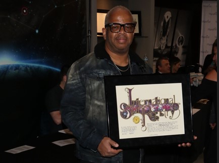 Terence Blanchard holding his name a star certificate from starregistry.com