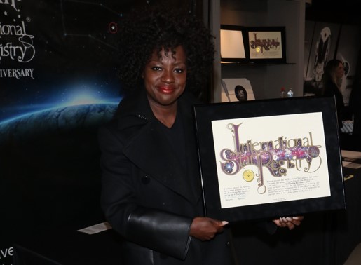 Viola Davis holding her name a star certificate from starregistry.com