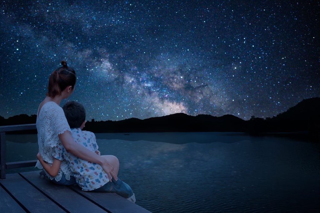 mother and son watch the stars