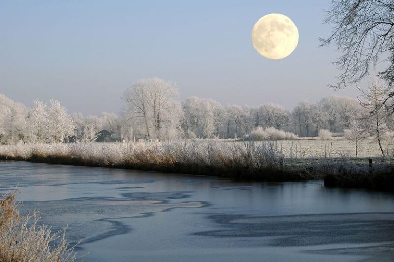 Full Snow Moon over the water