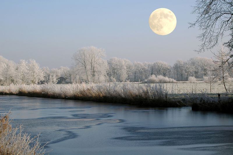 Full Snow Moon over the water