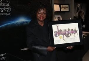 Image of Viola Davis holding her framed star gift for when she had a star named after her