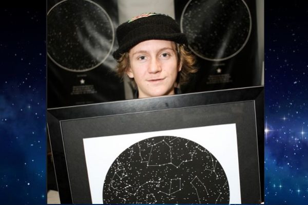 Red Gerard holding a sky map from International Star Registry