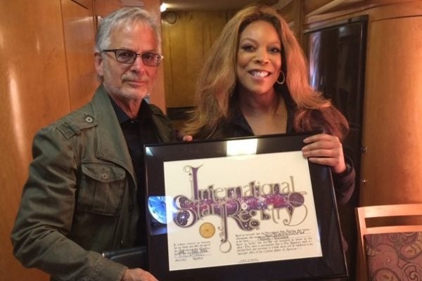 Wendy Williams holding her name a star certificate from starregistry.com