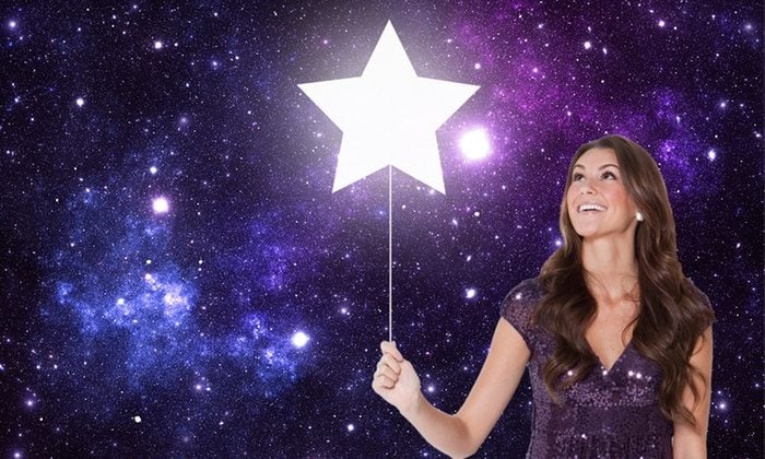 Girl with a star balloon at night